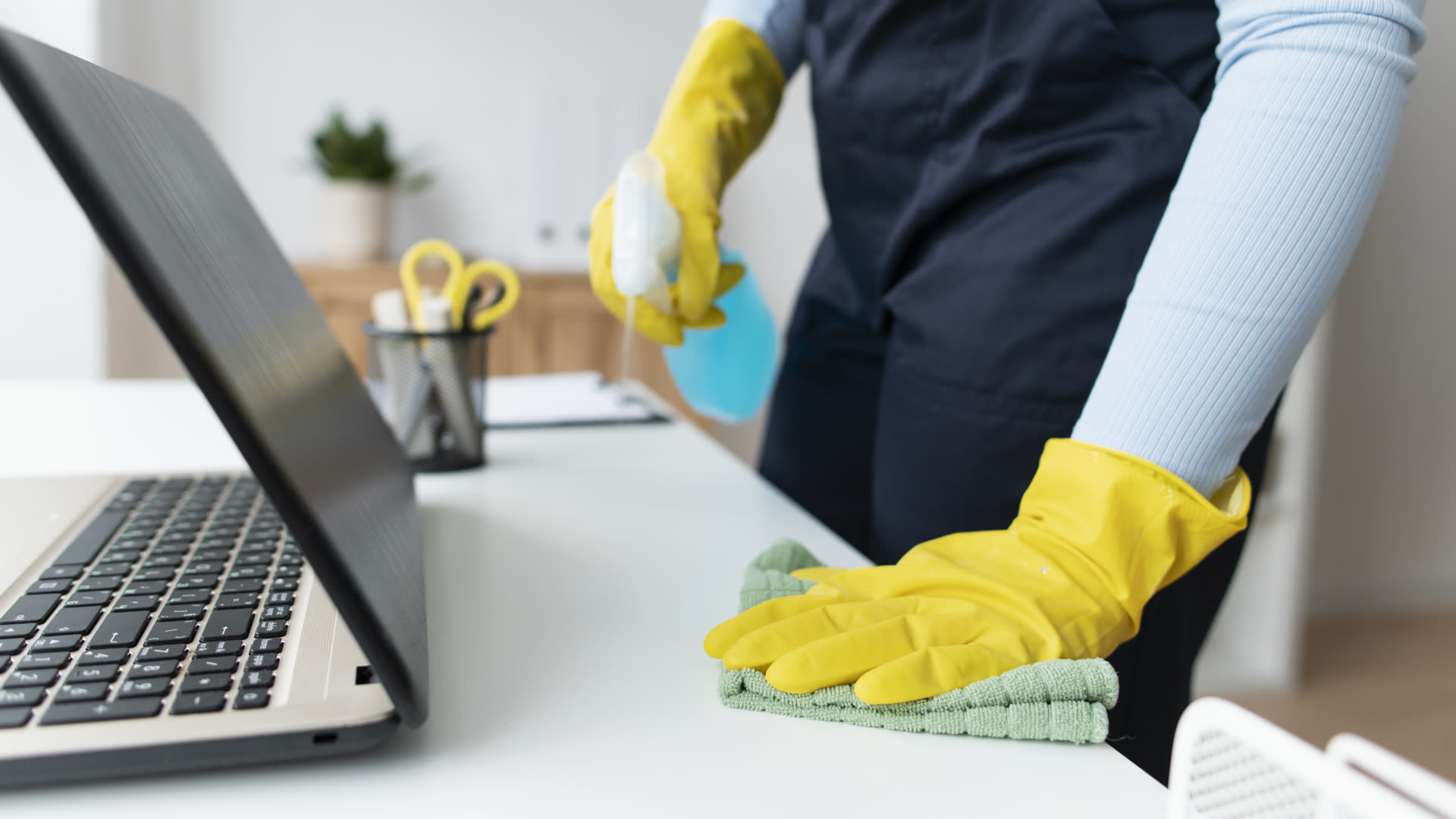 Dalta Building Services cleaning professional at work in a commercial office